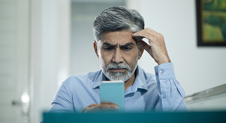 Businessman using mobile phone at office